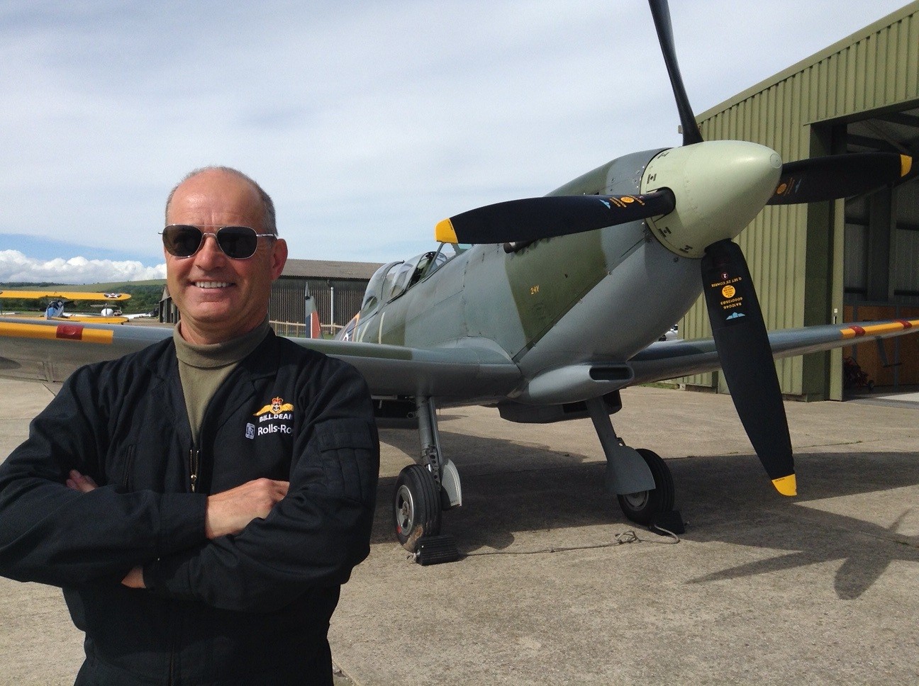 Bill Dean stood in front of a plane