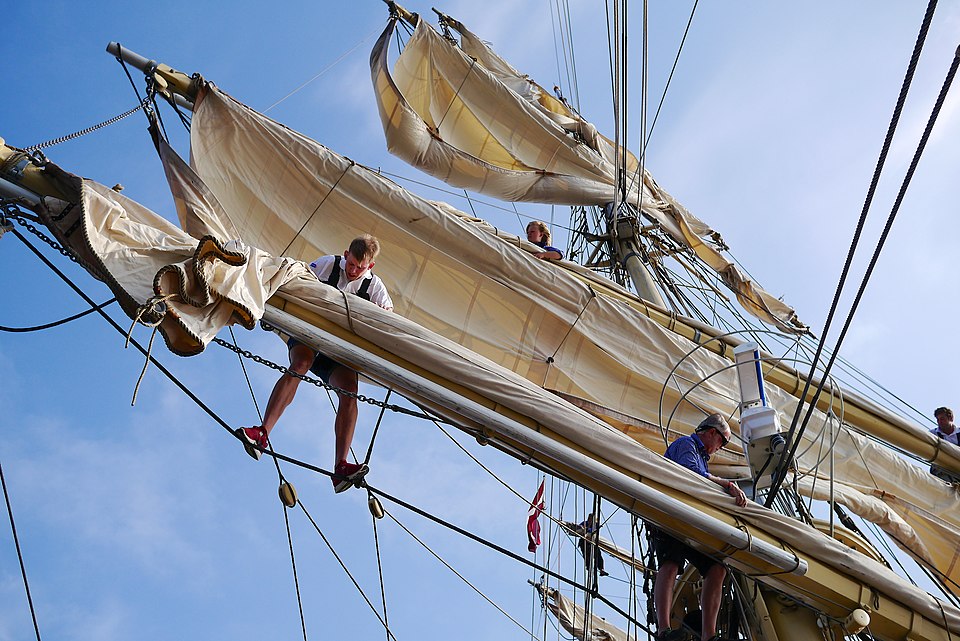 Sailors working aloft the Tre Kronor af Stockholm during the Tall Ships' Races 2013. https://commons.wikimedia.org/wiki/File:Tre_Kronor_aloft_2013.jpg